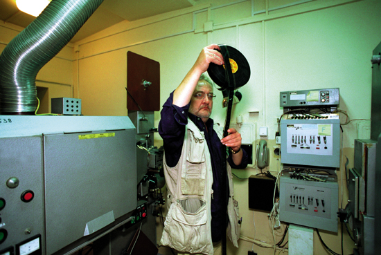 Producer Tomasz Filipczak holding film strip from EDEN